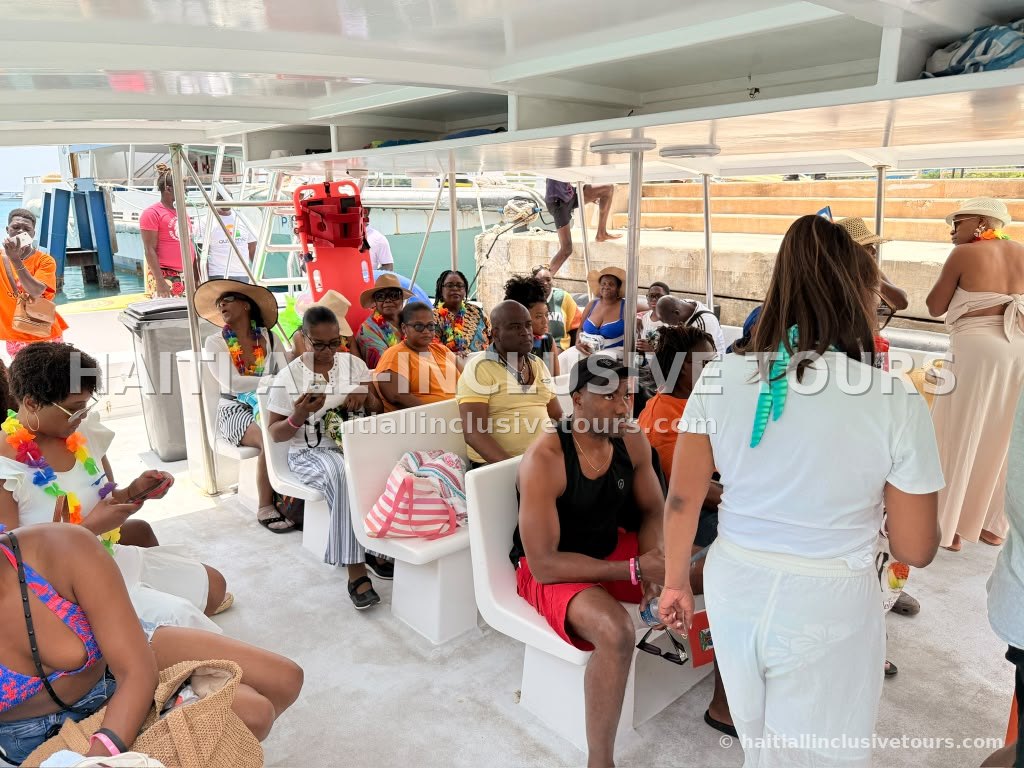 Our full group seated aboard the boat at the dock in Cap-Haïtien