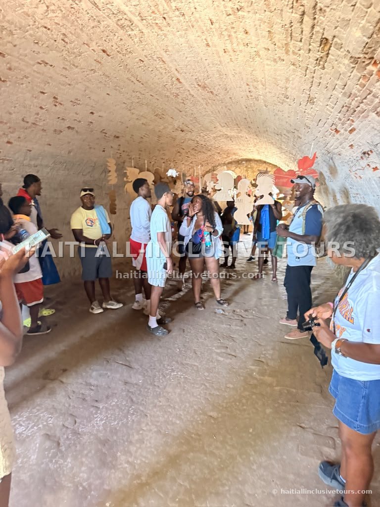 Our group touring the vaulted stone tunnels of a historic Northern Haiti fort